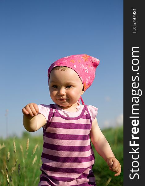 Happy baby girl on green meadow. Happy baby girl on green meadow