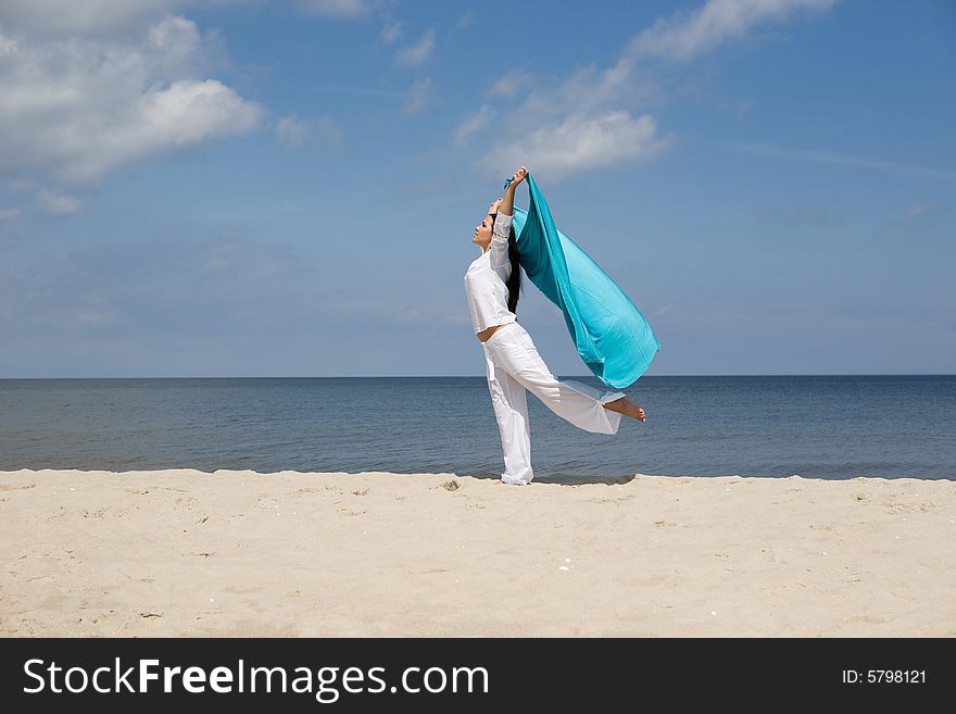 Attractive brunette woman relaxing on beach. Attractive brunette woman relaxing on beach