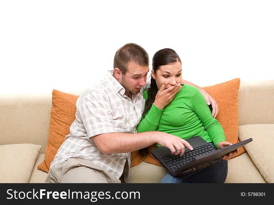 Happy couple sitting on sofa with laptop. Happy couple sitting on sofa with laptop