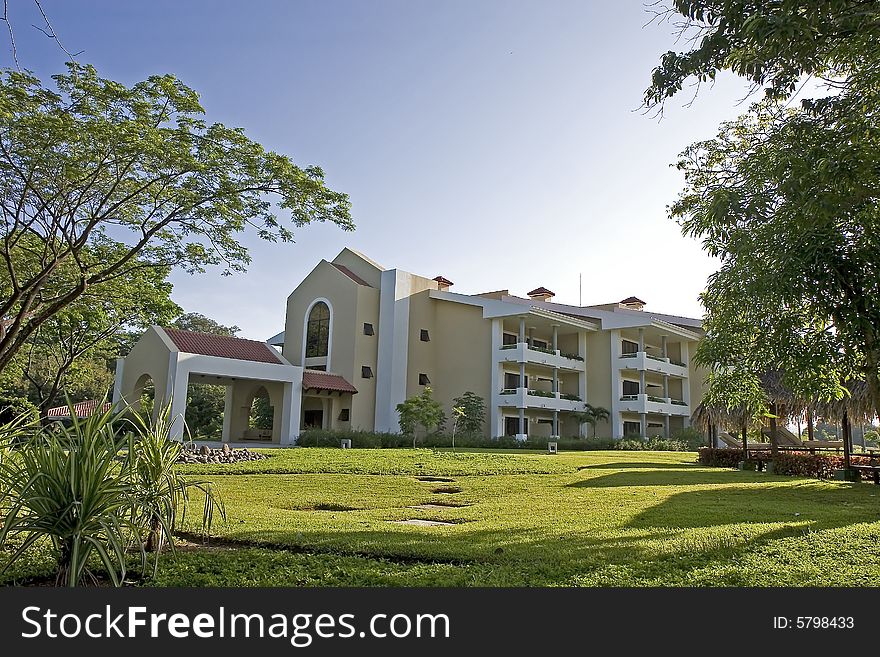 A luxury resort hotel on landscaped grounds. A luxury resort hotel on landscaped grounds
