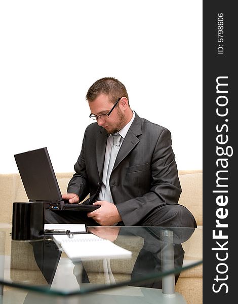 Happy man sitting on sofa with laptop. Happy man sitting on sofa with laptop