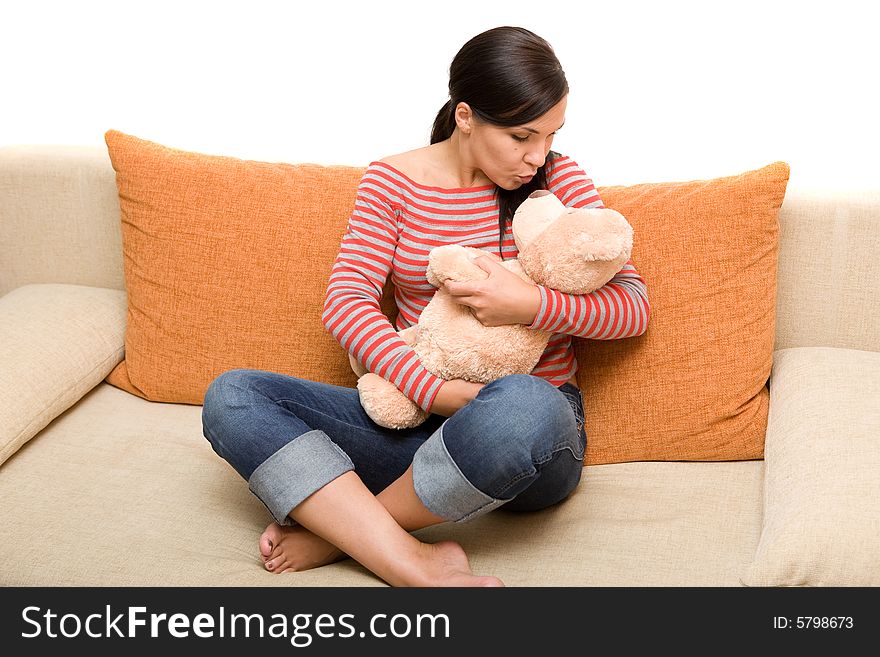 Attractive brunette woman on sofa. Attractive brunette woman on sofa