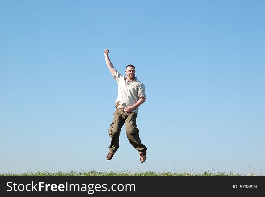 Happy man jumping on meadow. Happy man jumping on meadow