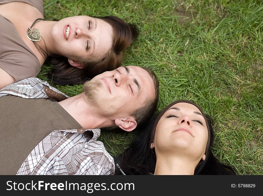 Friends together relaxing on grass. Friends together relaxing on grass