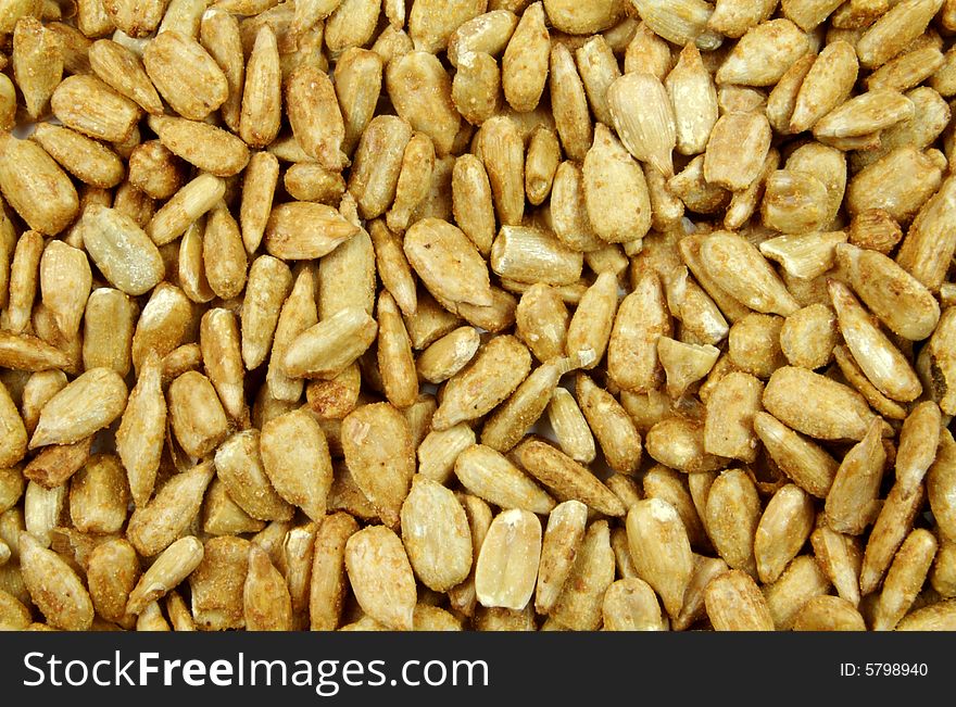 A close up photograph of sunflower seeds. A close up photograph of sunflower seeds