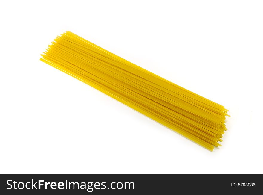 A photograph of dried spaghetti against a white background