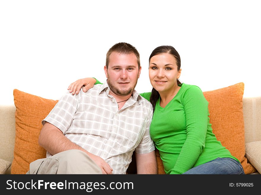 Happy family sitting on sofa. Happy family sitting on sofa