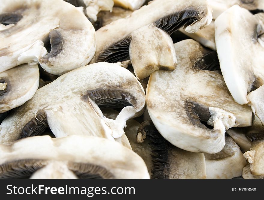 Sliced mushrooms close up. Focus on the mushrooms at the front.