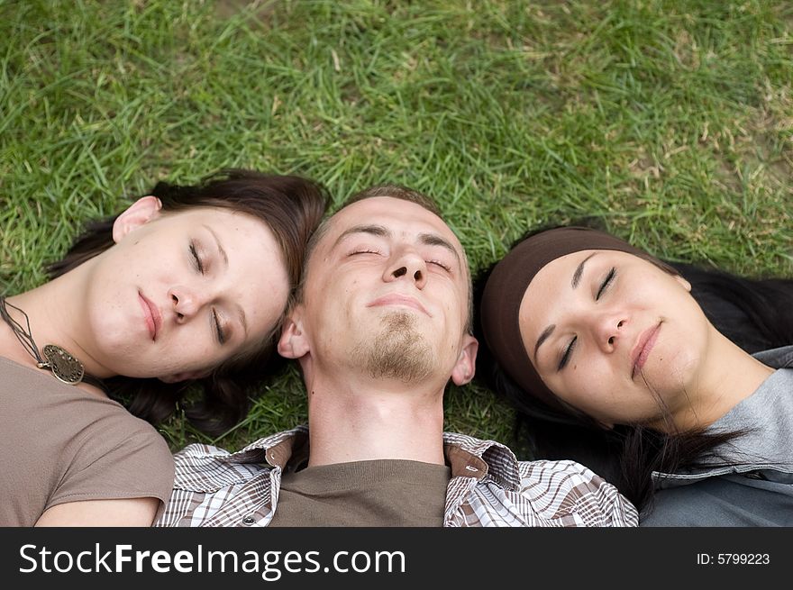 Friends together relaxing on grass. Friends together relaxing on grass