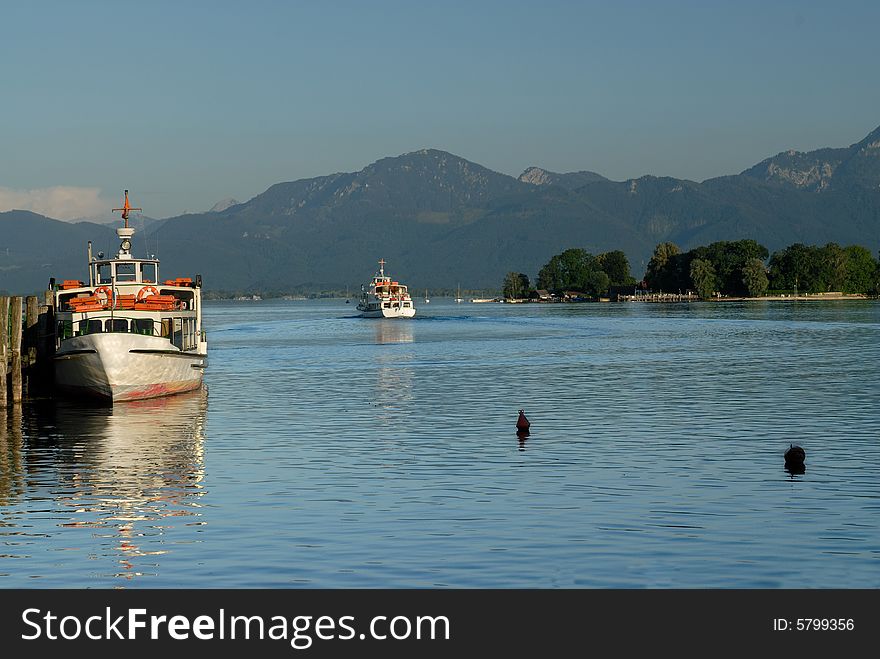Two ships on the Bavarian Alps lake in sunset