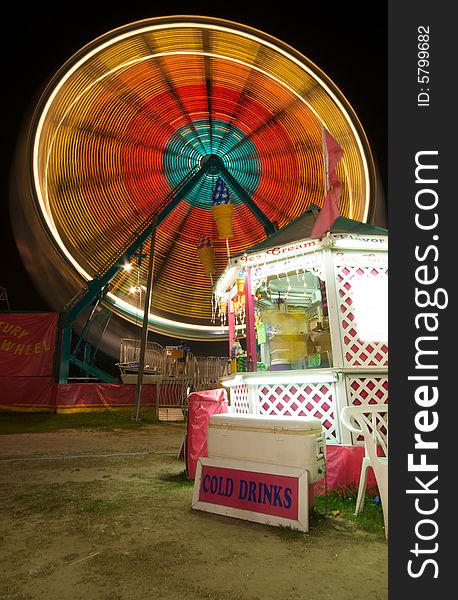 Ice Cream Stand at Carnival with Ferris Wheel. Ice Cream Stand at Carnival with Ferris Wheel