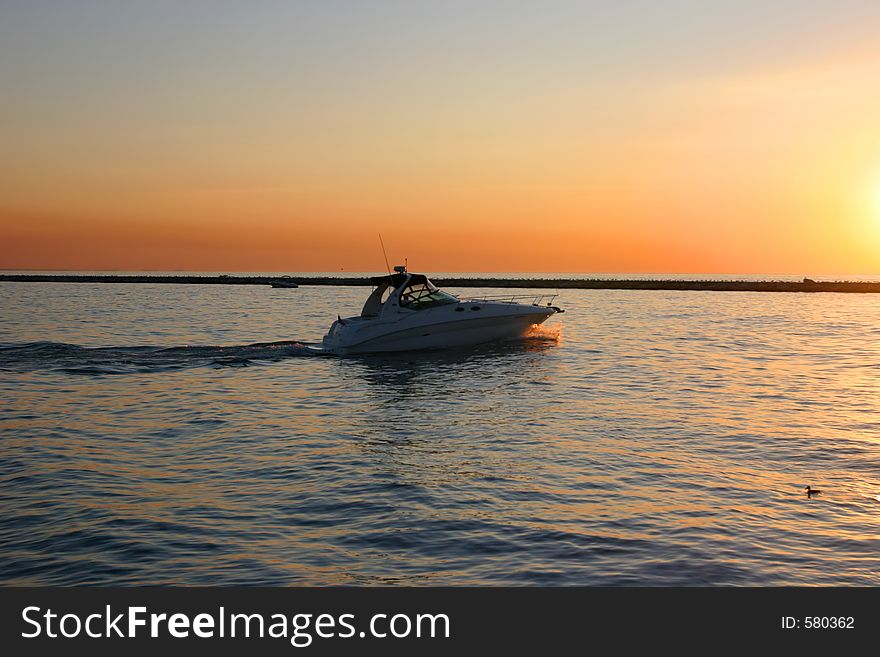 Motorboat at sunset, captured at Michigan City. Motorboat at sunset, captured at Michigan City.