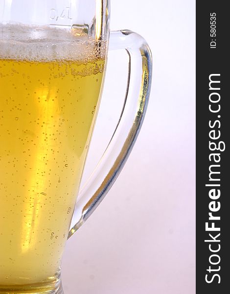 A freshly poured glass of beer. A freshly poured glass of beer.