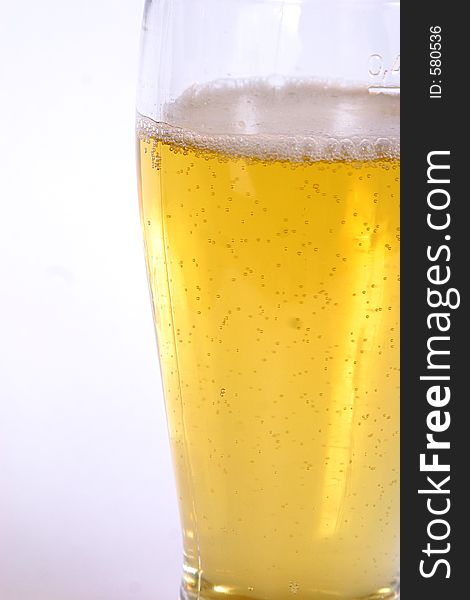 A freshly poured glass of beer. A freshly poured glass of beer.