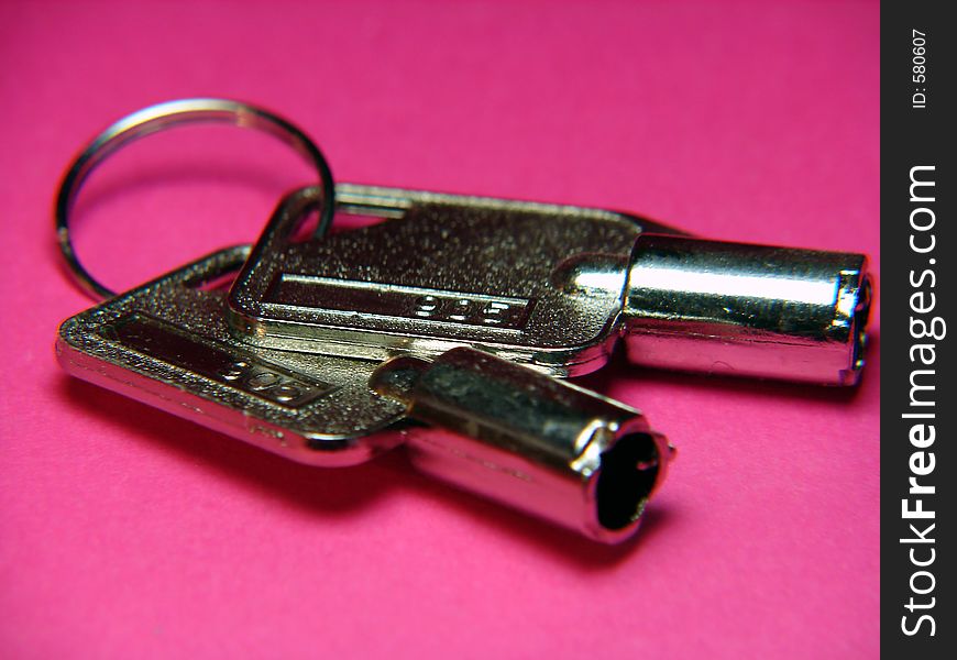 PC computer keys close up macro. Pink background.