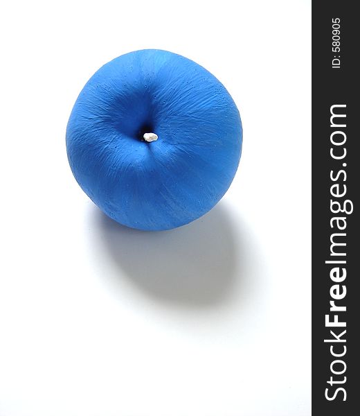 Blue apple, isolated, vertical photo.