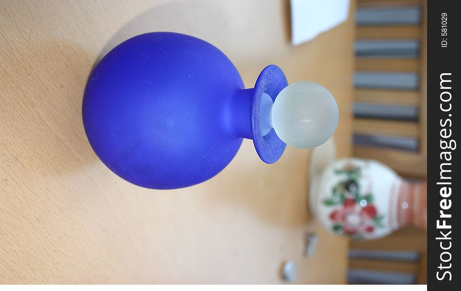 Blue round bottle with a stopper in the top