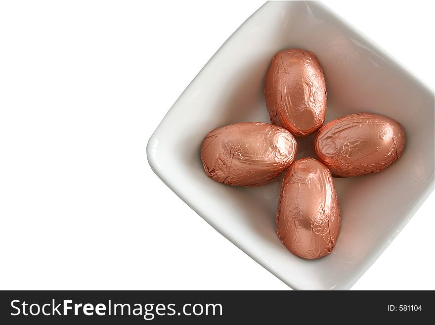 Foil covered candy in a square dish