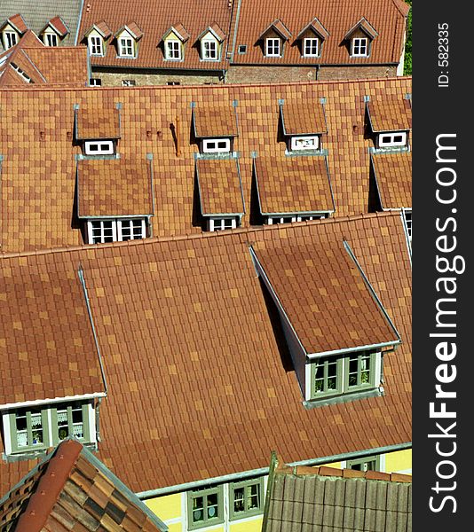 A birdÂ´s-eye view of several roofs.