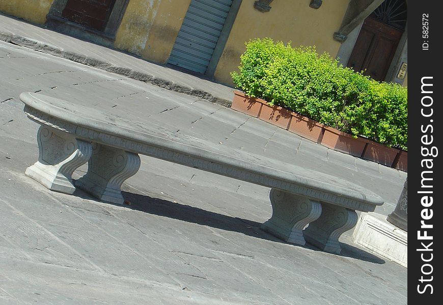 The stone bench in Santa Croce Square, Florence, Italy