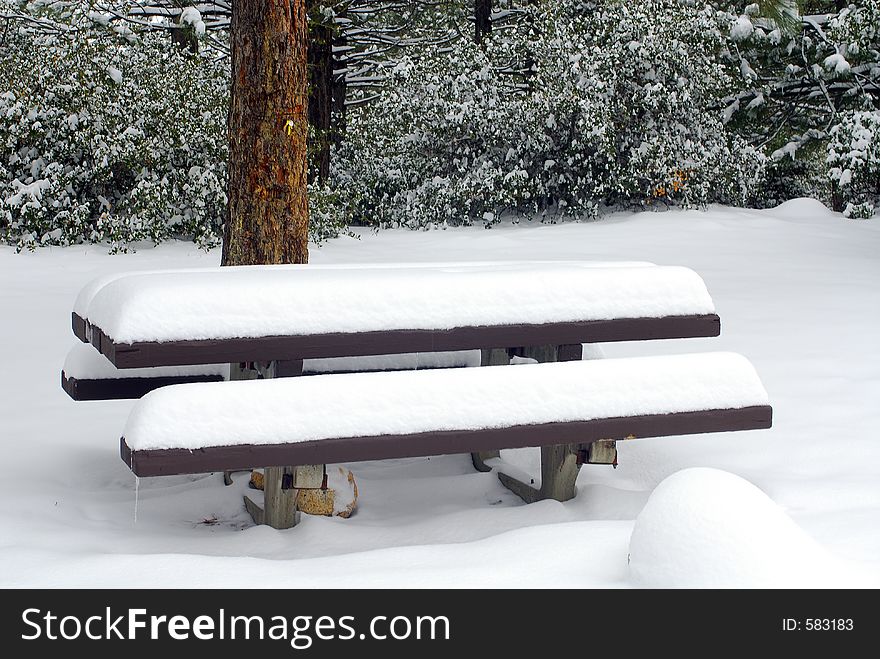 Picnic table in winter after frech snowfall