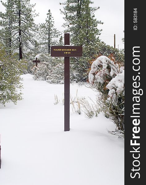 Hiking path trail sign in winter