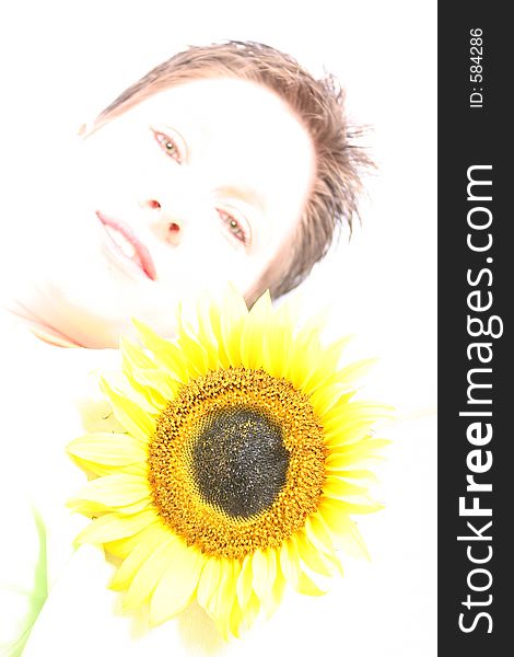 Close up of a woman's face and a sunflower. Close up of a woman's face and a sunflower