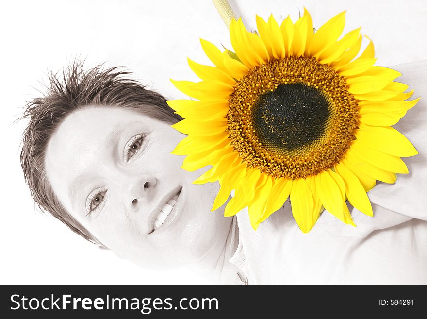 Close up of a woman's face and a sunflower. Close up of a woman's face and a sunflower