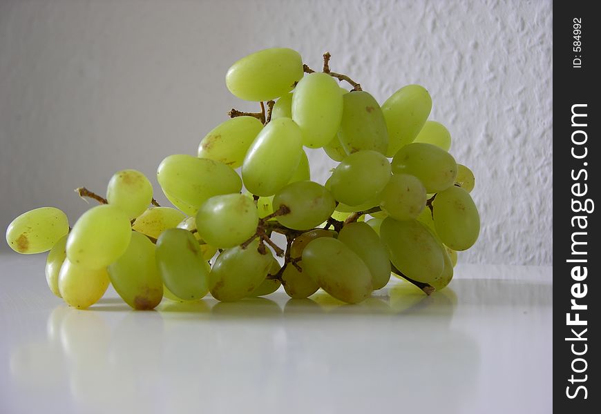 Some grapes in the kitchen