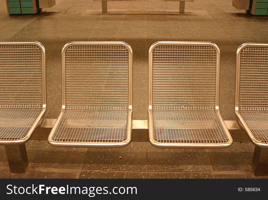Chairs in a subway stationin berlin. Chairs in a subway stationin berlin