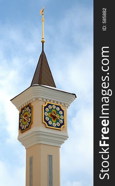 Clock tower with a weathercock