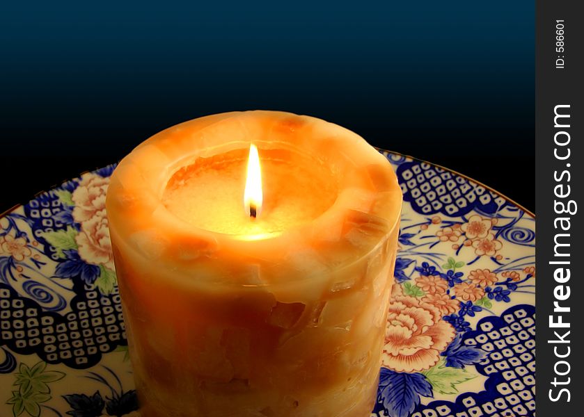 Candle On China Plate