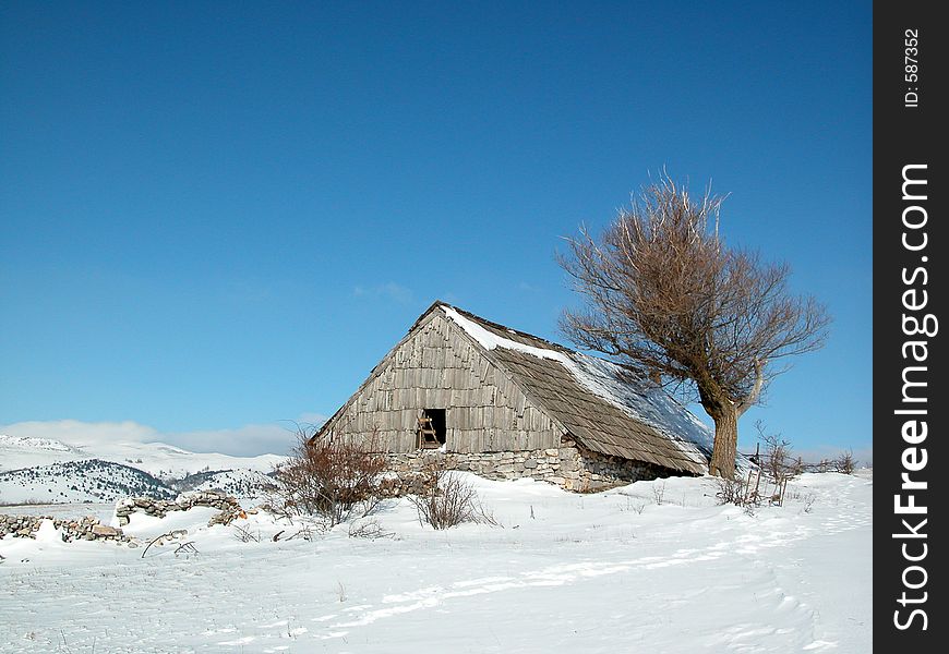 Old wooden house in winter. Old wooden house in winter