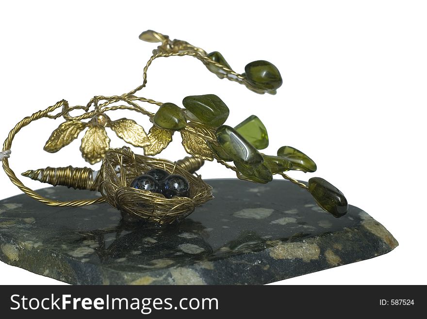 Stone and metal nest with eggs, artwork. Stone and metal nest with eggs, artwork