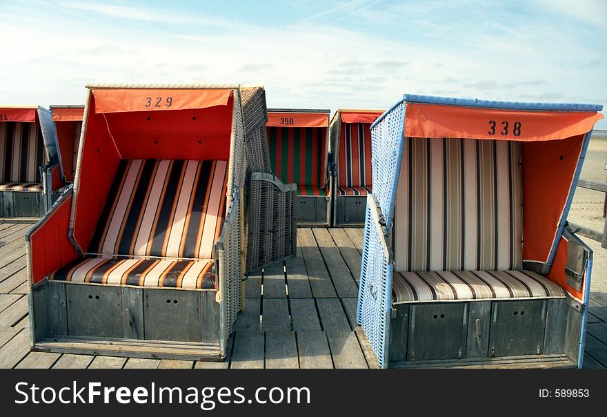 Beach-chairs are waiting for guests. Beach-chairs are waiting for guests.