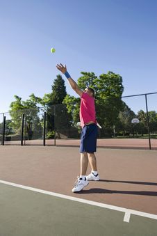 Man On Tennis Court Playing Tennis - Vertical Royalty Free Stock Photography Man On Tennis Court Playing Tennis - Vertical Royalty Free Stock Photography