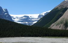 Ice Lake, Trees And Snow Moutain Stock Images