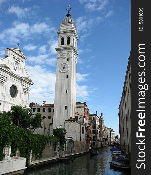 A church in Venice, Italy, leans slightly next to a canal. A church in Venice, Italy, leans slightly next to a canal