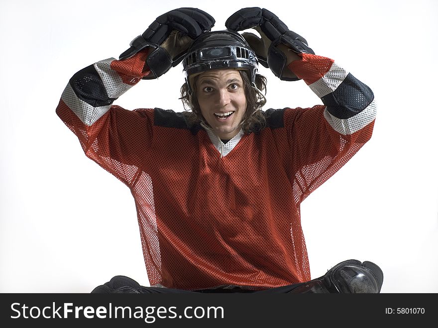 Hockey player jokes around with his hands on top of his head. Horizontally framed photograph. Hockey player jokes around with his hands on top of his head. Horizontally framed photograph