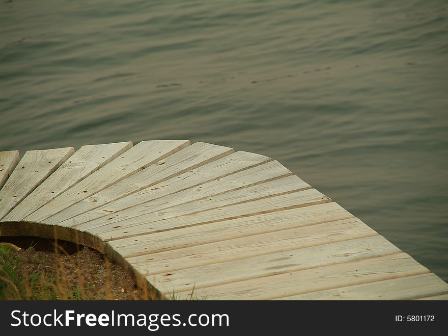 Wooden dock curve over river