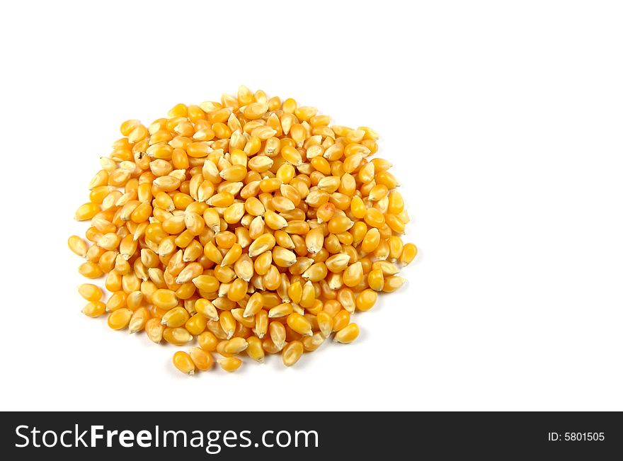 A photograph of popcorn seeds against a white background. A photograph of popcorn seeds against a white background