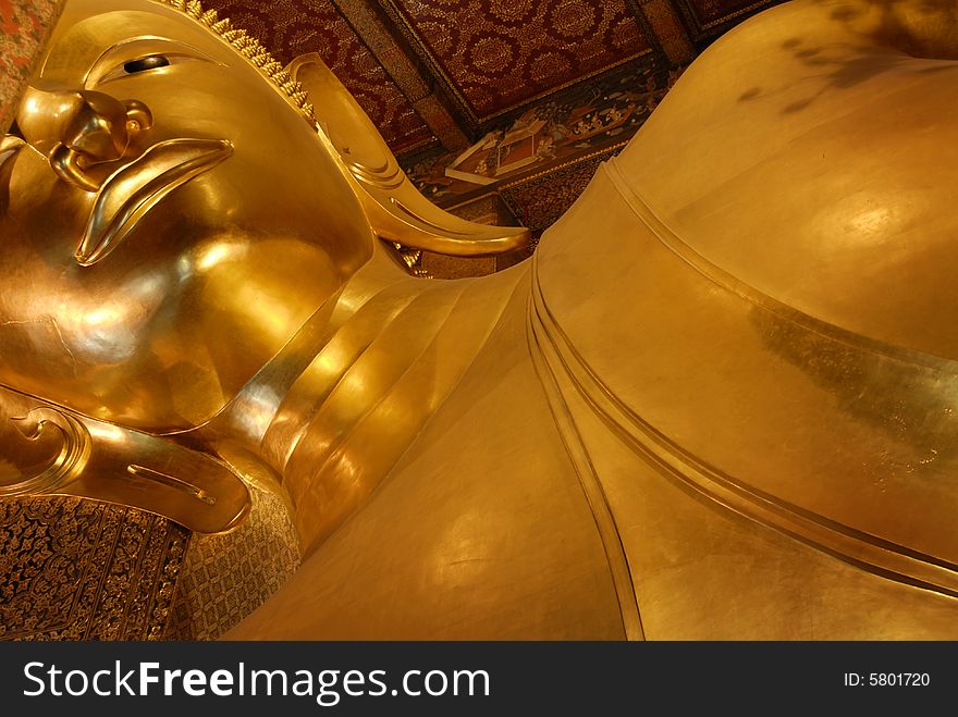 The Buddhist Temple Wat Pho, commonly known as the Temple of the Reclining Buddha, was originally built in 1688 in the Phra Nakhon district of Bangkok Thailand. The temple, however, didn't actually contain the 46m long, 15m high Reclining Buddha until it's casting in 1832 during the reign of King Rama III.