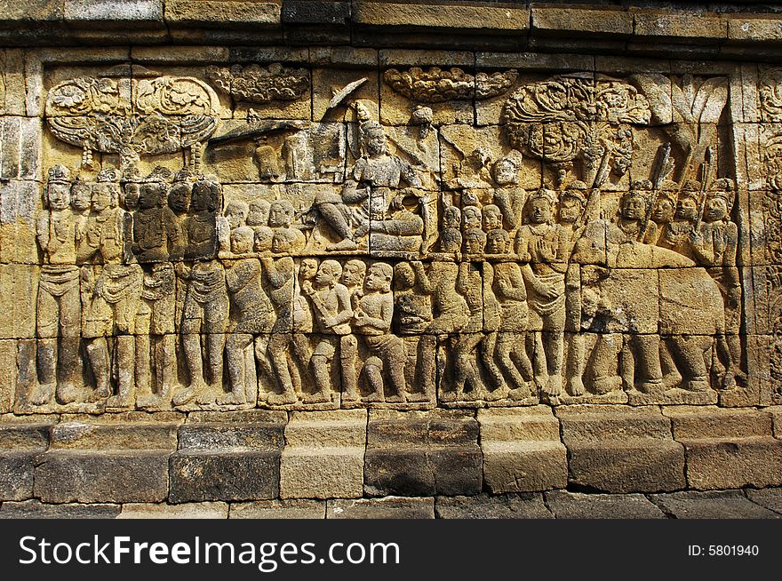 Indonesia, Central Java. The temple of Borobudur is a Mahayana Buddhist temple from the 9th century with a main shrine and several perforated stupas. View of the carved panels