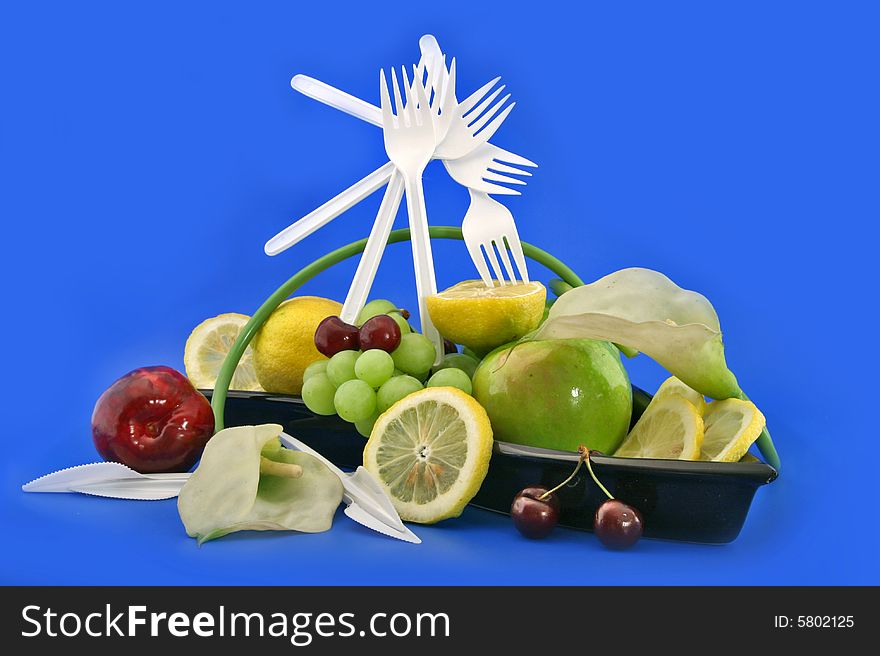 Composition from plastic forks and  from fruit and citrus. Composition from plastic forks and  from fruit and citrus