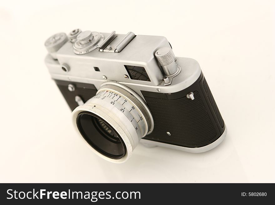 Old photo camera isolated on white