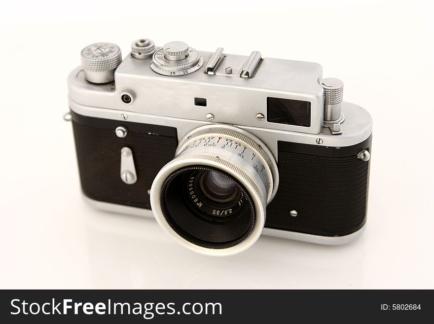 Old photo camera isolated on white