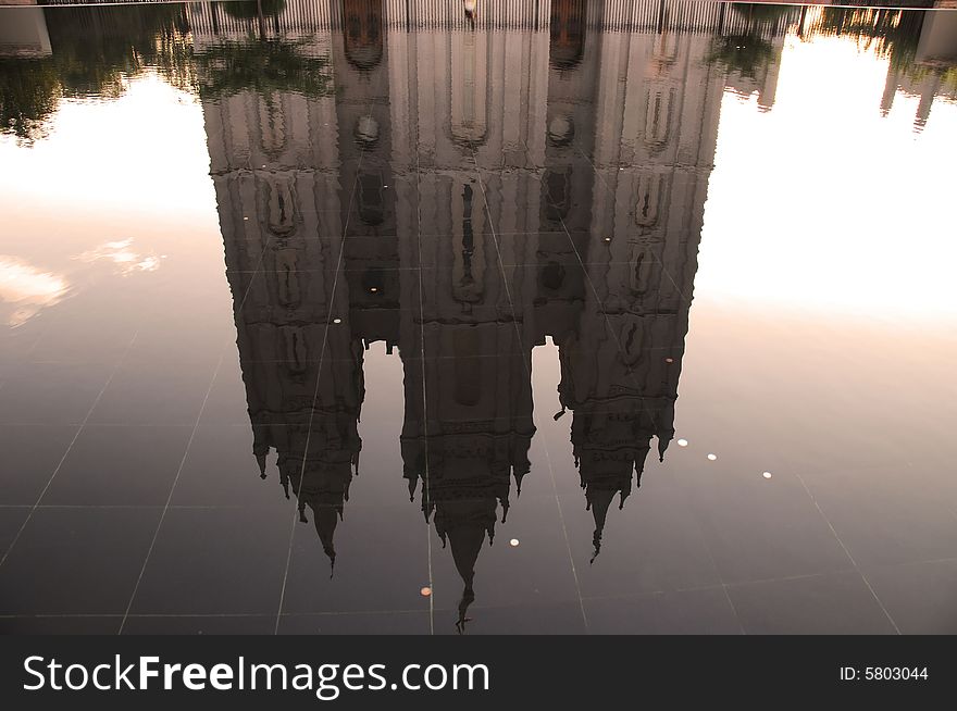 A water reflection of a holy building