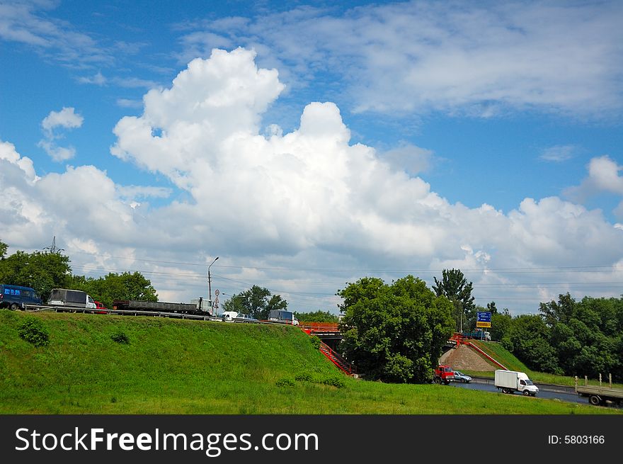Summer, cloudy sky, view on road interchange