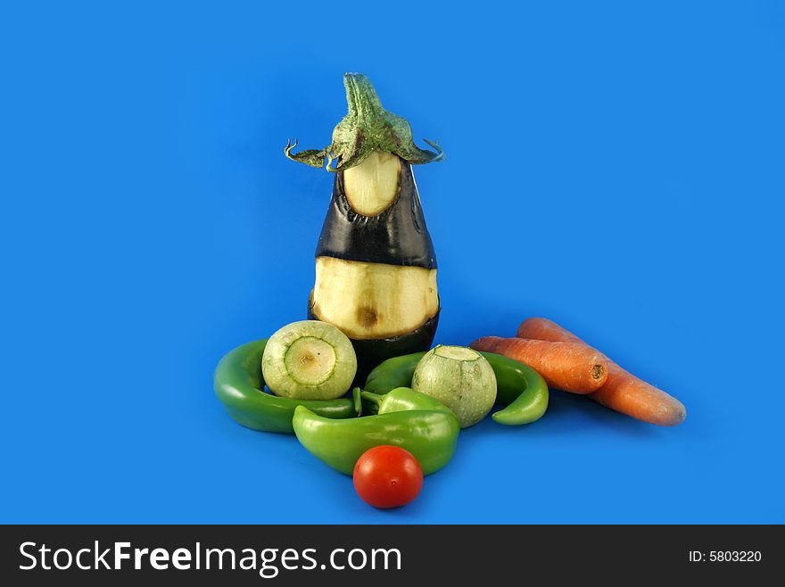 The cut out figure from a vegetable of an eggplant and vegetables. The cut out figure from a vegetable of an eggplant and vegetables