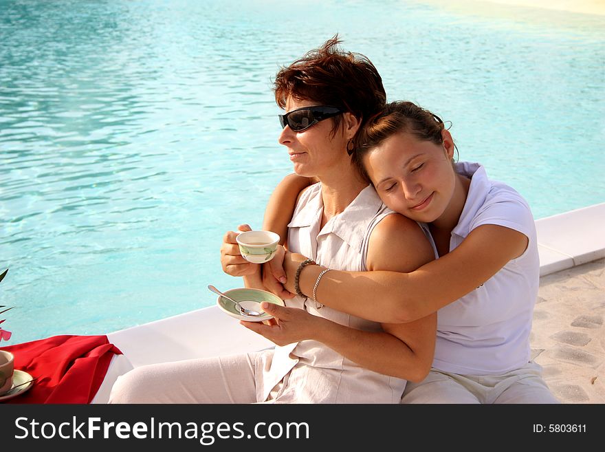 Mother and daghter in swimming pool